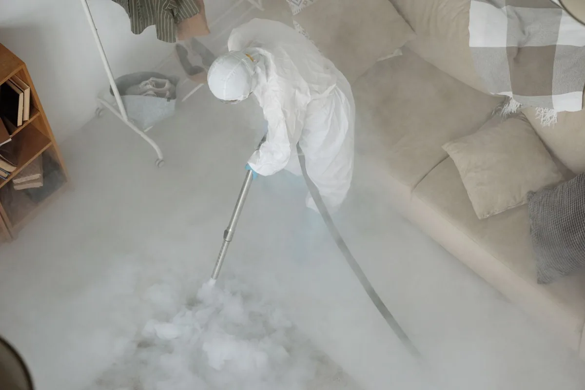 Biohazard cleanup technician in protective equipment, Spring Branch Central, Houston, TX